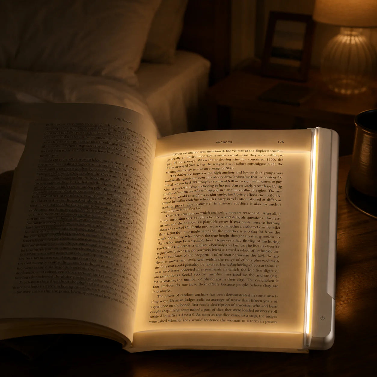 LumiPage LED reading light illuminating a book on the nightstand