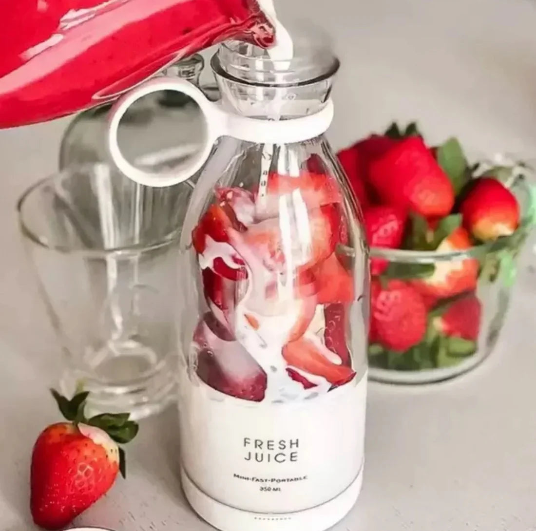 Blender filled with strawberries